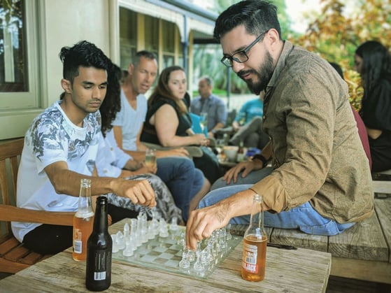 Oliberth and Kheminda battling it out in a chess game before dinner